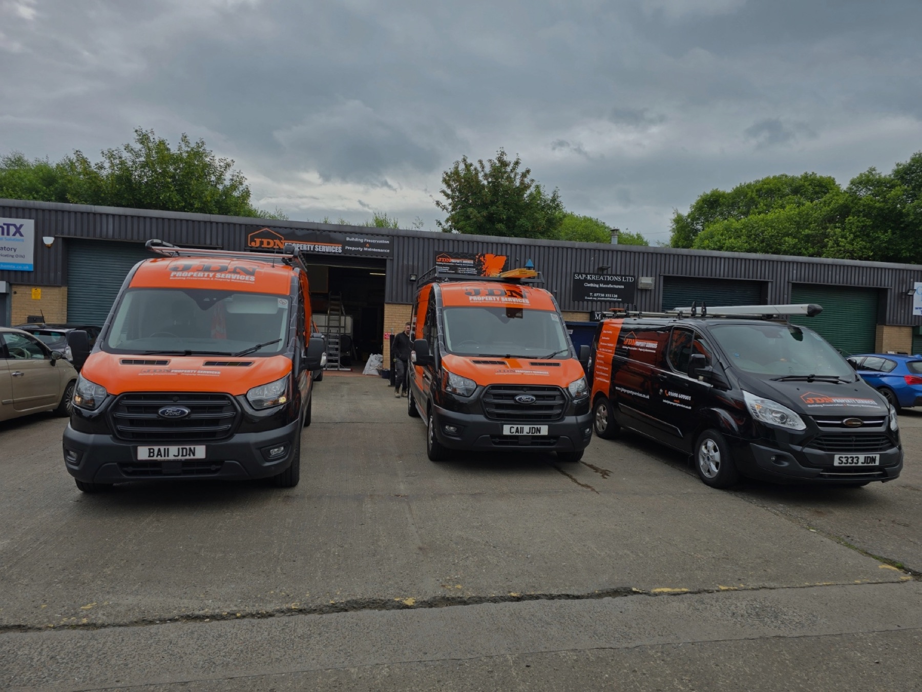 Three JDN Property Services vans parked outside the unit at Ashtree Industrial Estate, Wishaw